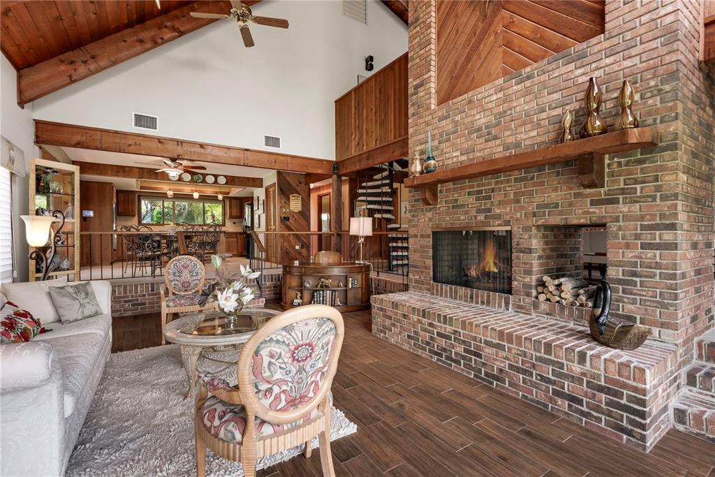 112 1st Street Tavares, FL 32778 - Photo 20 of 38 a living room with furniture and a fireplace