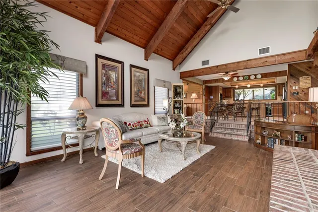 a dining room with furniture and a chandelier