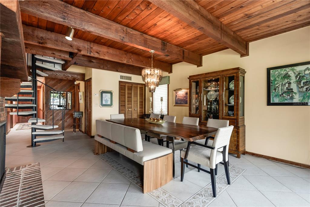 112 1st Street Tavares, FL 32778 - Photo 22 of 38 a dining room with furniture and a chandelier