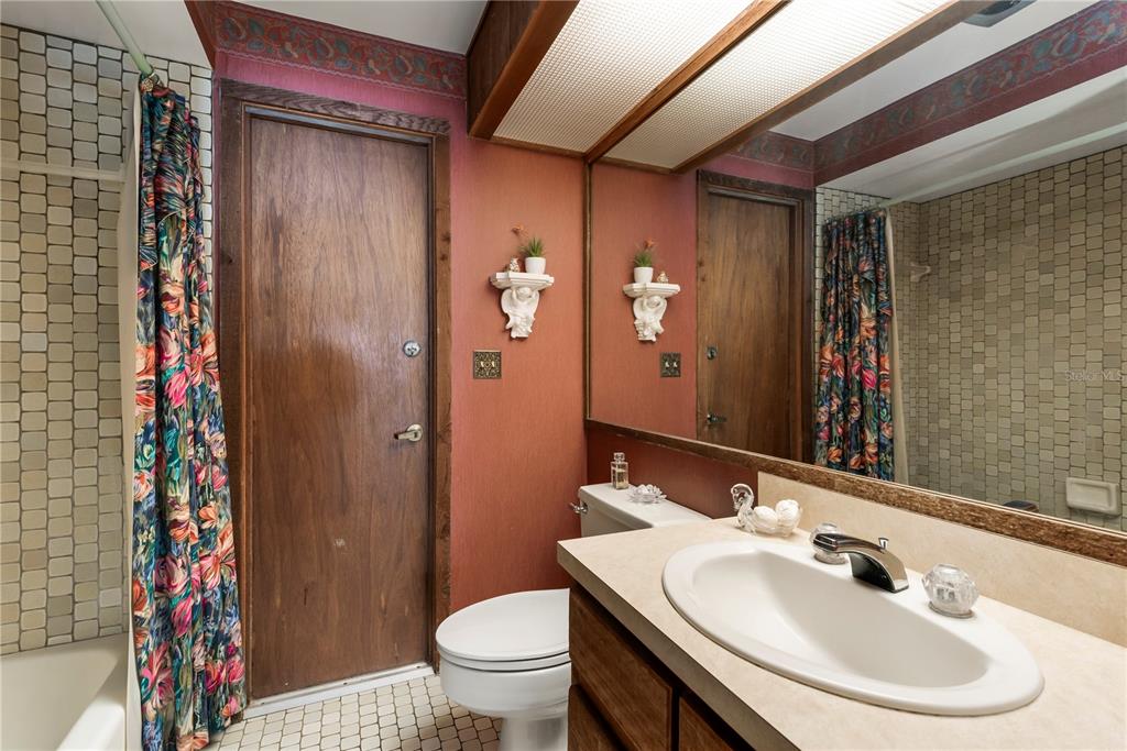 112 1st Street Tavares, FL 32778 - Photo 24 of 38 a bathroom with a sink toilet and shower