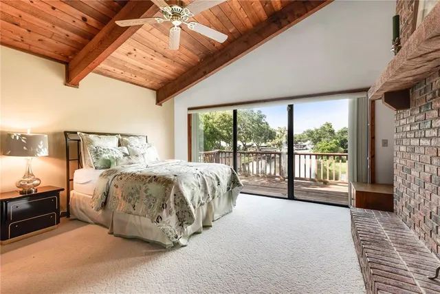 a bedroom with a bed and a fireplace