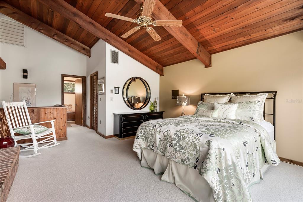 112 1st Street Tavares, FL 32778 - Photo 29 of 38 a bed room with a bed and a chair