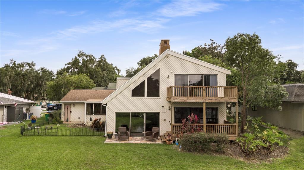 112 1st Street Tavares, FL 32778 - Photo 32 of 38 a front view of a house with a yard