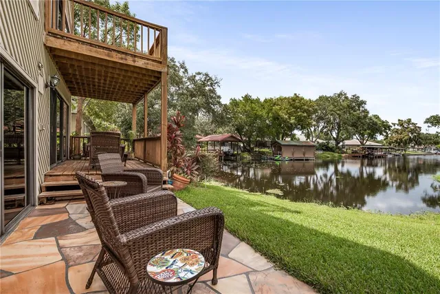 a view of a lake with houses in the back