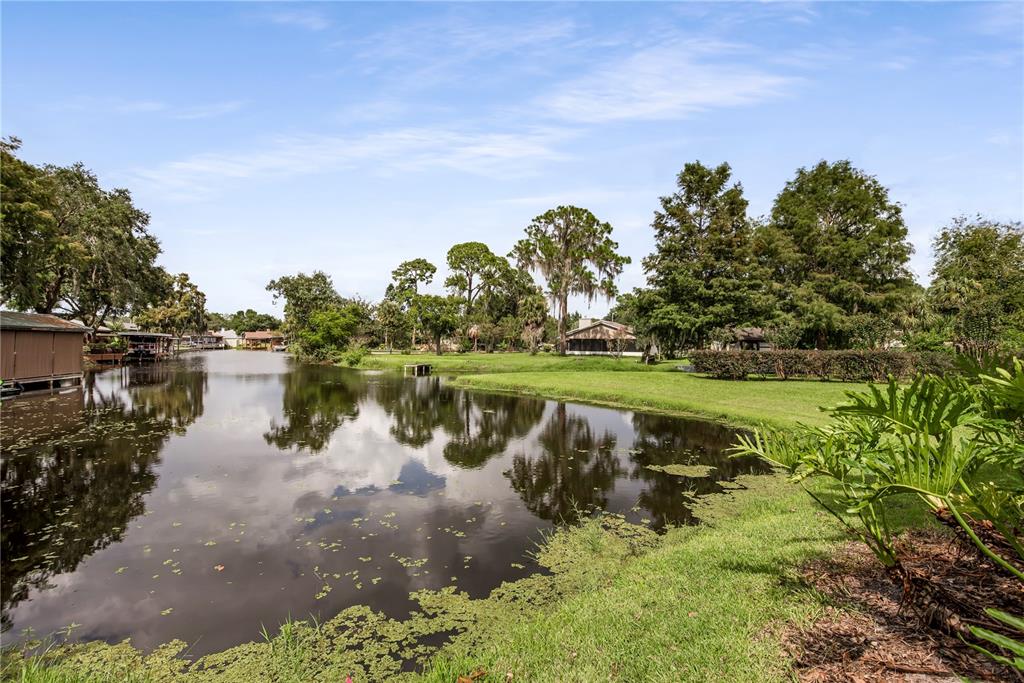 112 1st Street Tavares, FL 32778 - Photo 35 of 38 a view of a lake with houses in the back