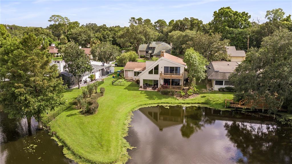 112 1st Street Tavares, FL 32778 - Photo 4 of 38 a view of a house with a lake view