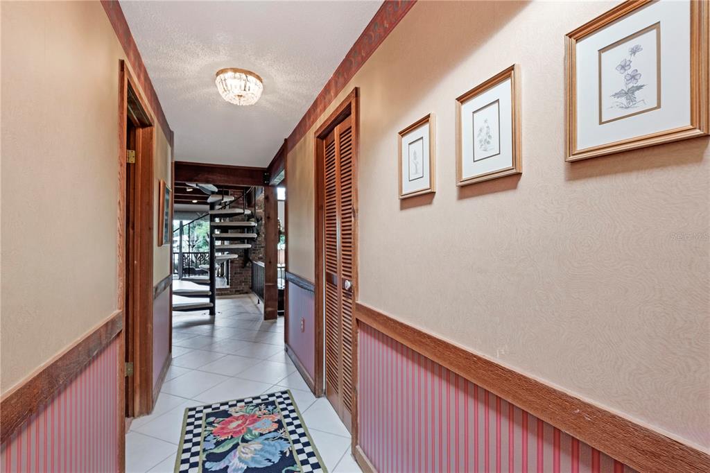 112 1st Street Tavares, FL 32778 - Photo 10 of 38 a hallway with furniture and stairs