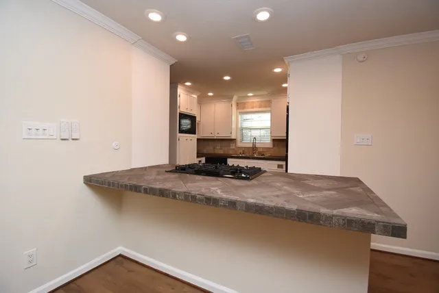 a view of a bathroom from a hallway