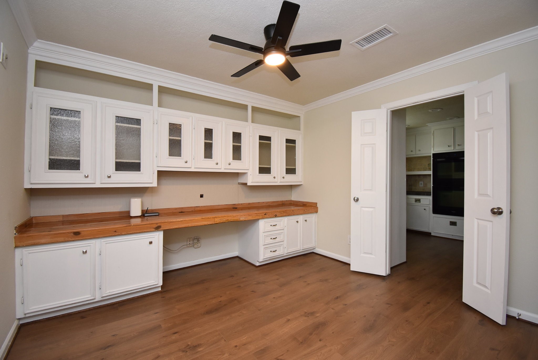 2503 Southwick Street Houston, TX 77080 - Photo 21 of 46 a large kitchen with stainless steel appliances granite countertop a hardwood floor and a sink