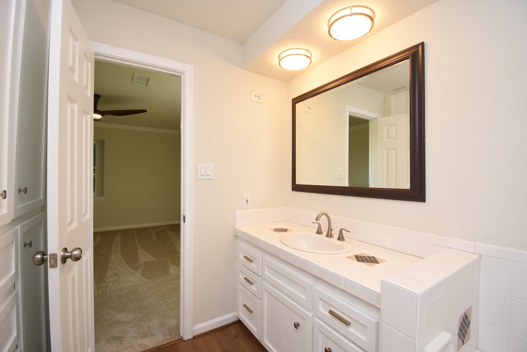 2503 Southwick Street Houston, TX 77080 - Photo 29 of 46 a bathroom with a sink vanity and mirror