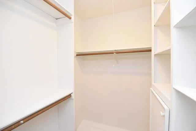 a white bath tub sitting next to a white toilet