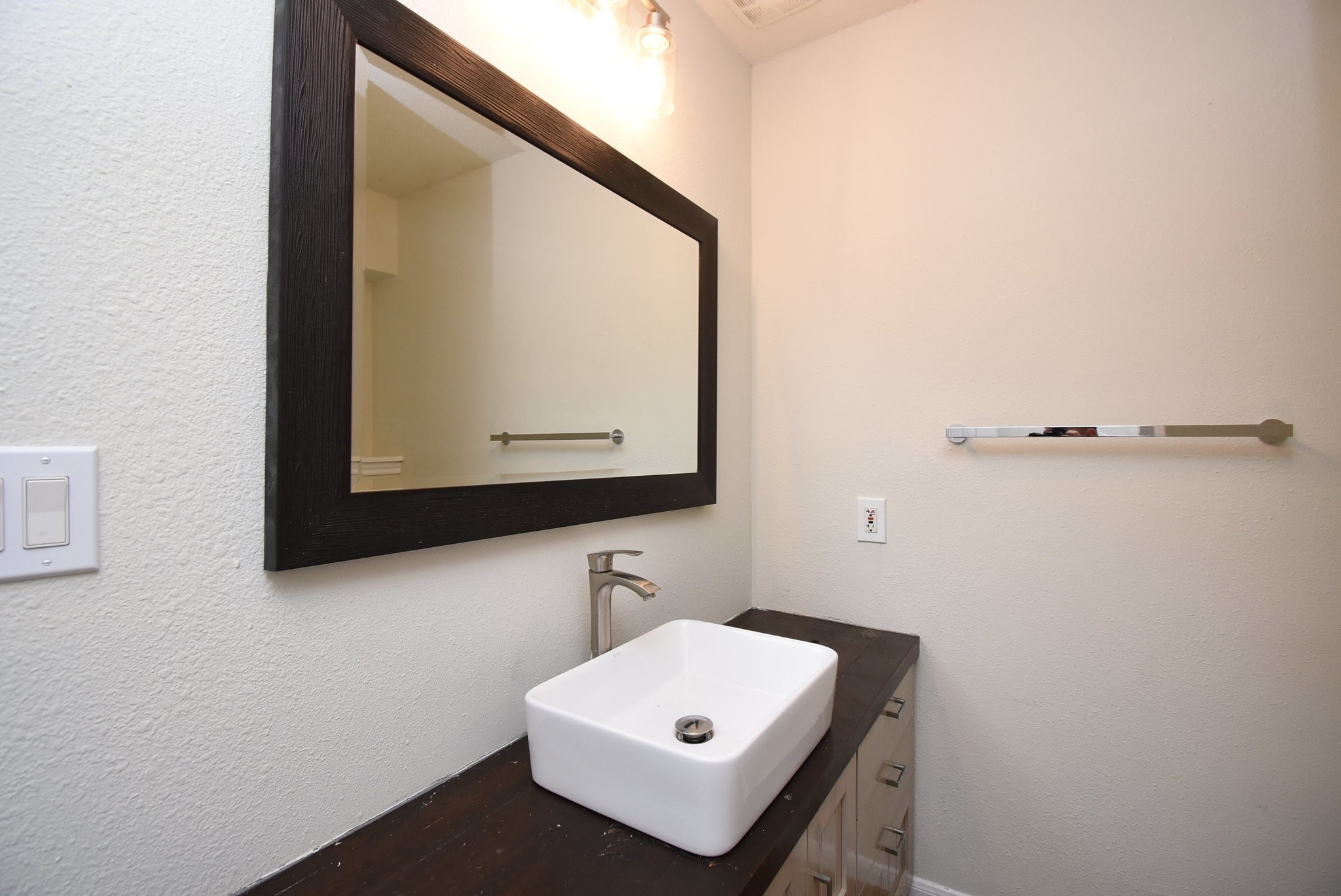 2503 Southwick Street Houston, TX 77080 - Photo 33 of 46 a bathroom with a sink and a mirror