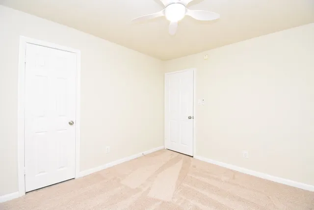 a view of a room with a fan