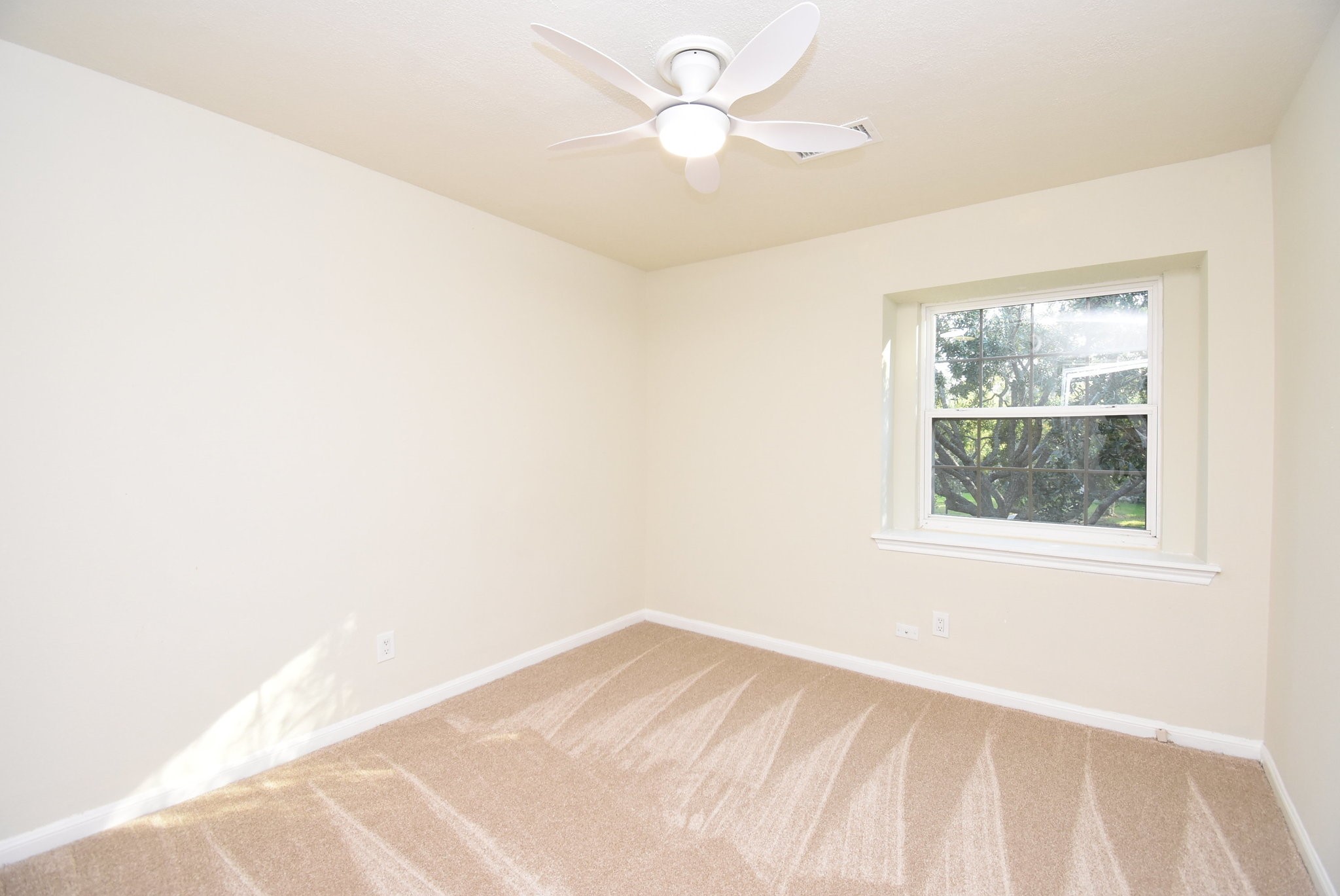 2503 Southwick Street Houston, TX 77080 - Photo 36 of 46 an empty room with a window and a fan