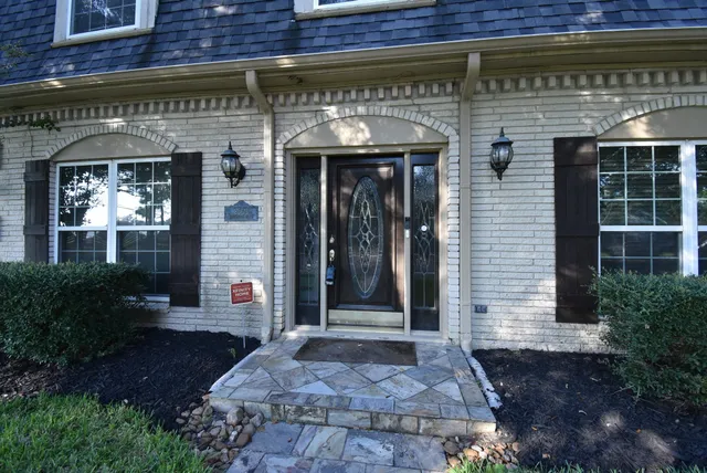 a front view of a building with garden