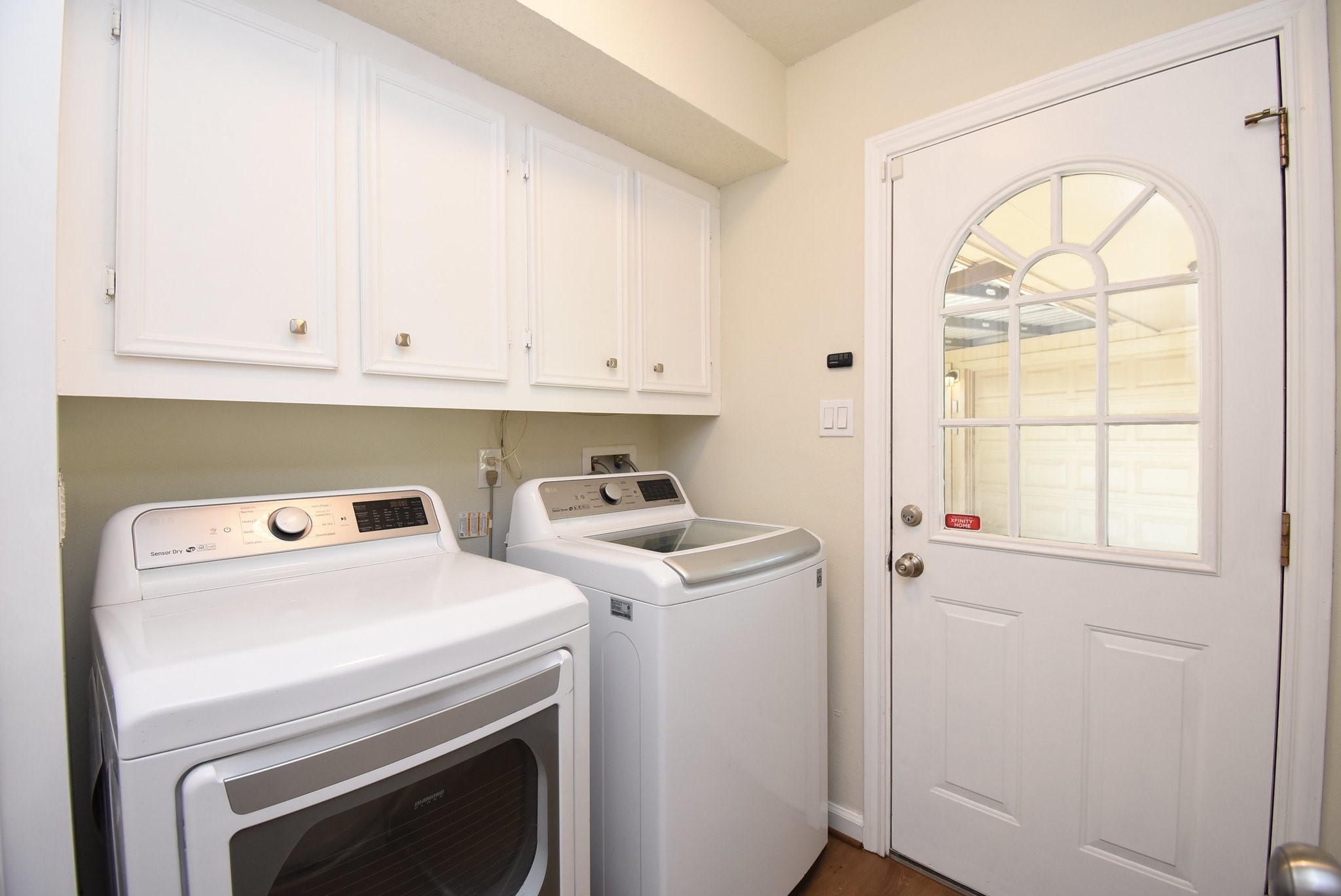 2503 Southwick Street Houston, TX 77080 - Photo 41 of 46 a view of washer and dryer with kitchen in the background