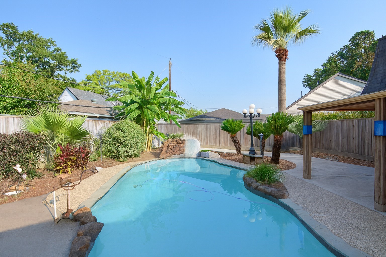 2503 Southwick Street Houston, TX 77080 - Photo 42 of 46 a front view of a house with a yard and a garden