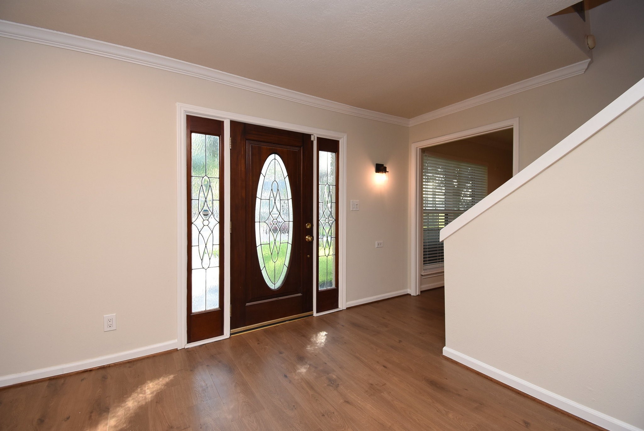 2503 Southwick Street Houston, TX 77080 - Photo 8 of 46 an entryway with wooden floor mirror and windows