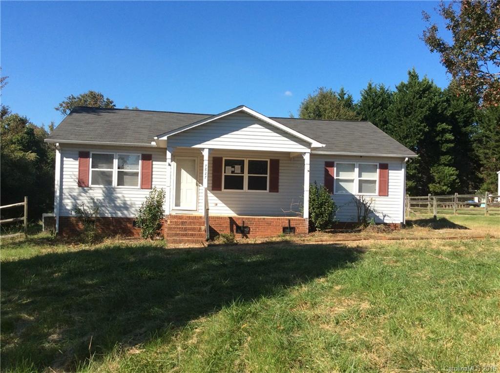 7827 Fisher Road Mount Pleasant, NC 28124 - Photo 1 of 5 a front view of a house with a yard