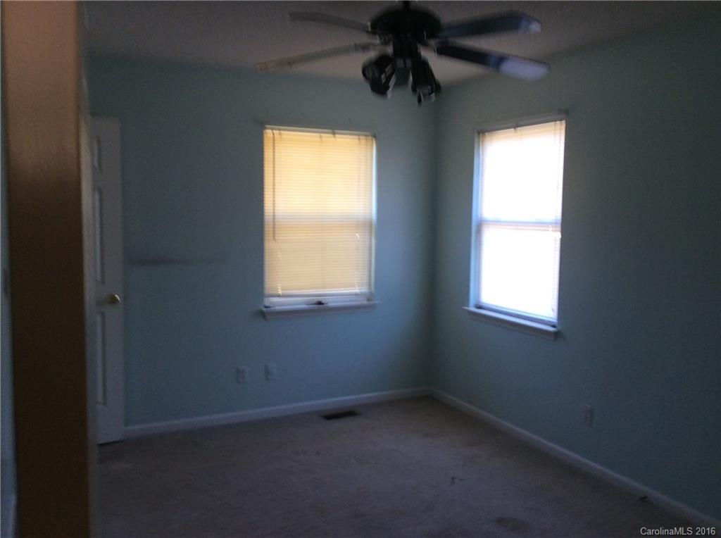 7827 Fisher Road Mount Pleasant, NC 28124 - Photo 3 of 5 an empty room with a window