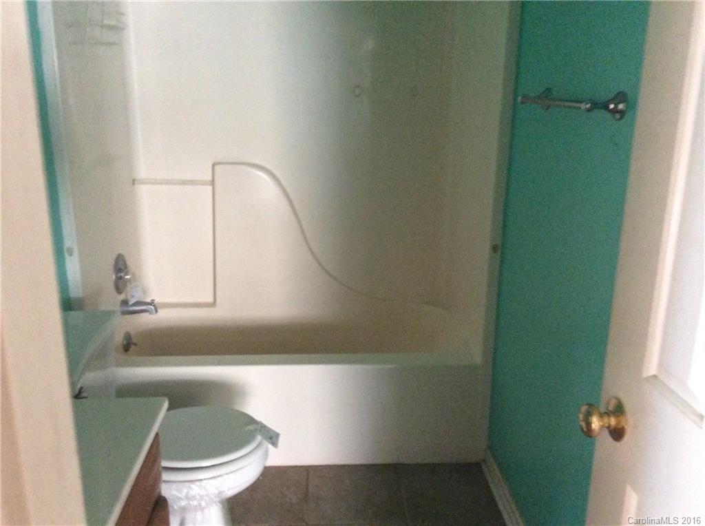 7827 Fisher Road Mount Pleasant, NC 28124 - Photo 4 of 5 a bathroom with a sink and toilet