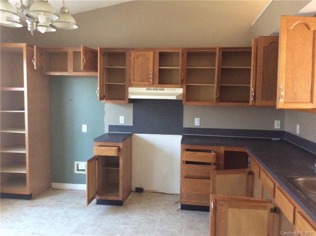 7827 Fisher Road Mount Pleasant, NC 28124 - Photo 5 of 5 a kitchen with cabinets and window