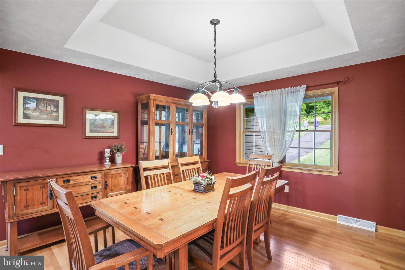 115 Packing House Road Hanover, PA 17331 - Photo 16 of 59 a view of a dining room with furniture window and wooden floor