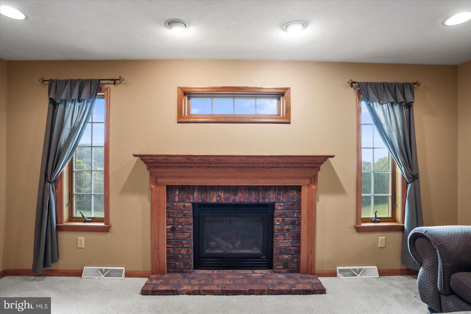 115 Packing House Road Hanover, PA 17331 - Photo 21 of 59 a living room with furniture and a fireplace