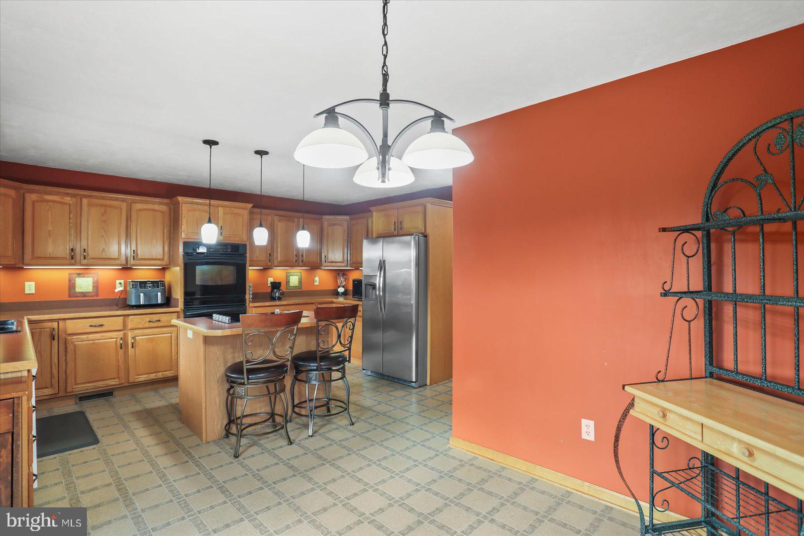 115 Packing House Road Hanover, PA 17331 - Photo 27 of 59 a kitchen with a dining table and chairs