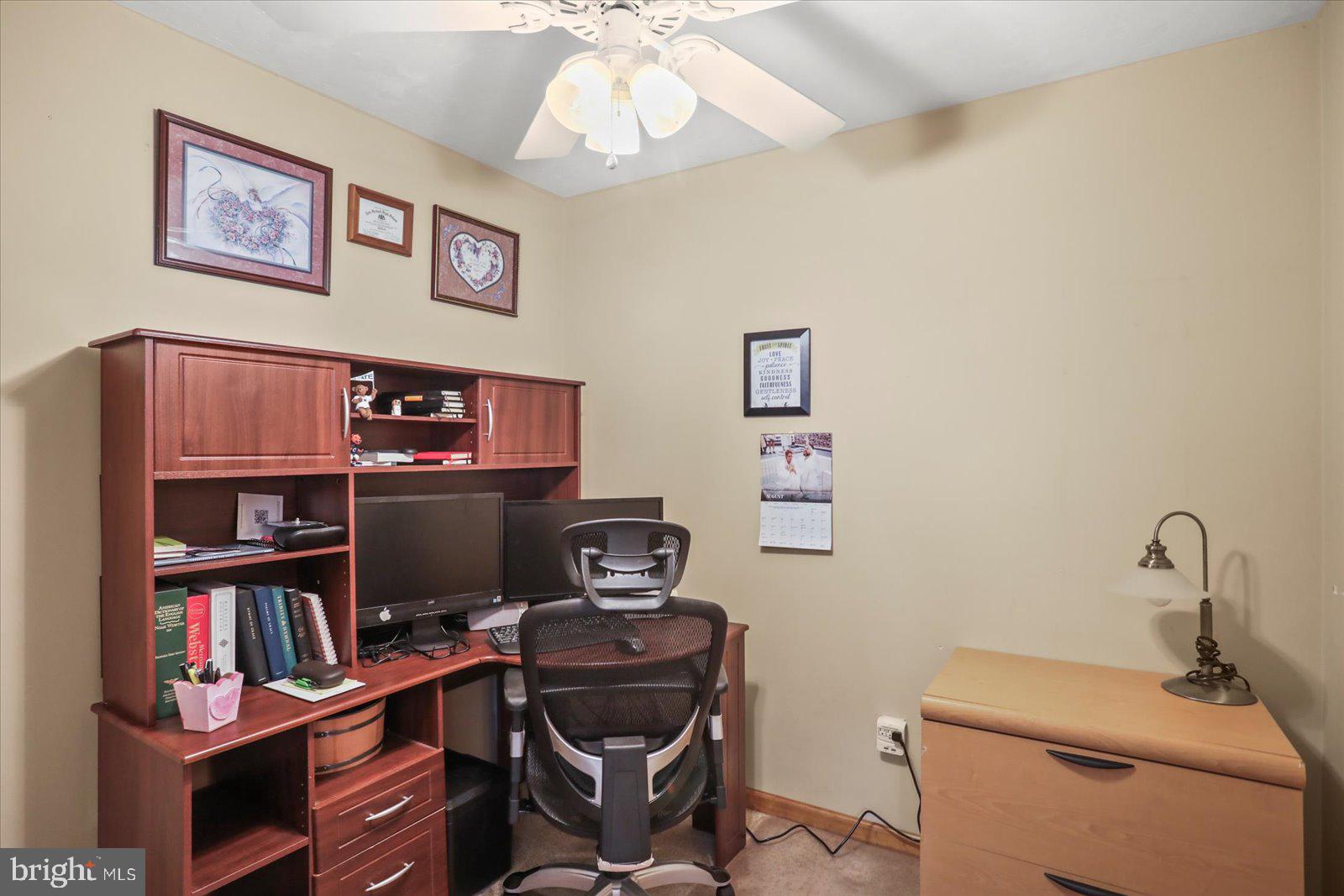 115 Packing House Road Hanover, PA 17331 - Photo 29 of 59 a view of a workspace with furniture and a book shelf