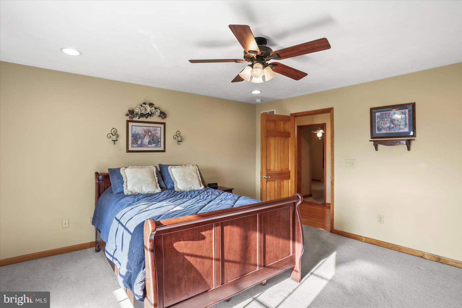 115 Packing House Road Hanover, PA 17331 - Photo 34 of 59 a bedroom with a bed and painting on the wall