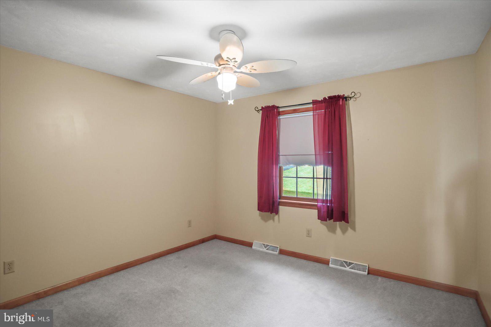 115 Packing House Road Hanover, PA 17331 - Photo 44 of 59 an empty room with windows and fan