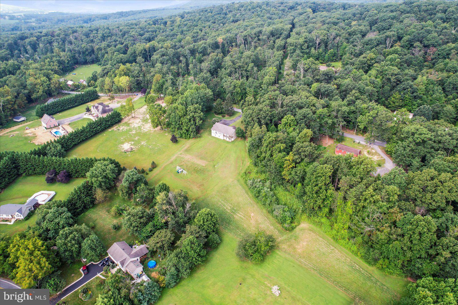 115 Packing House Road Hanover, PA 17331 - Photo 8 of 59 an aerial view of residential houses with outdoor space and trees all around