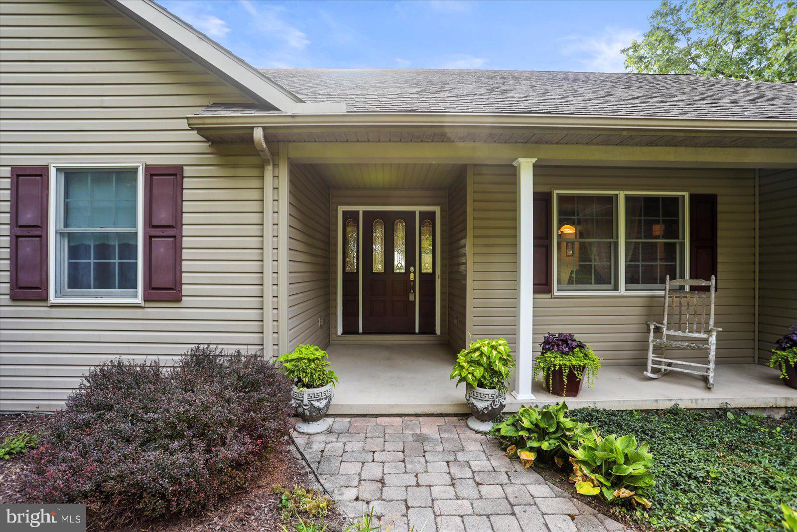 115 Packing House Road Hanover, PA 17331 - Photo 10 of 59 a front view of a house with potted plants