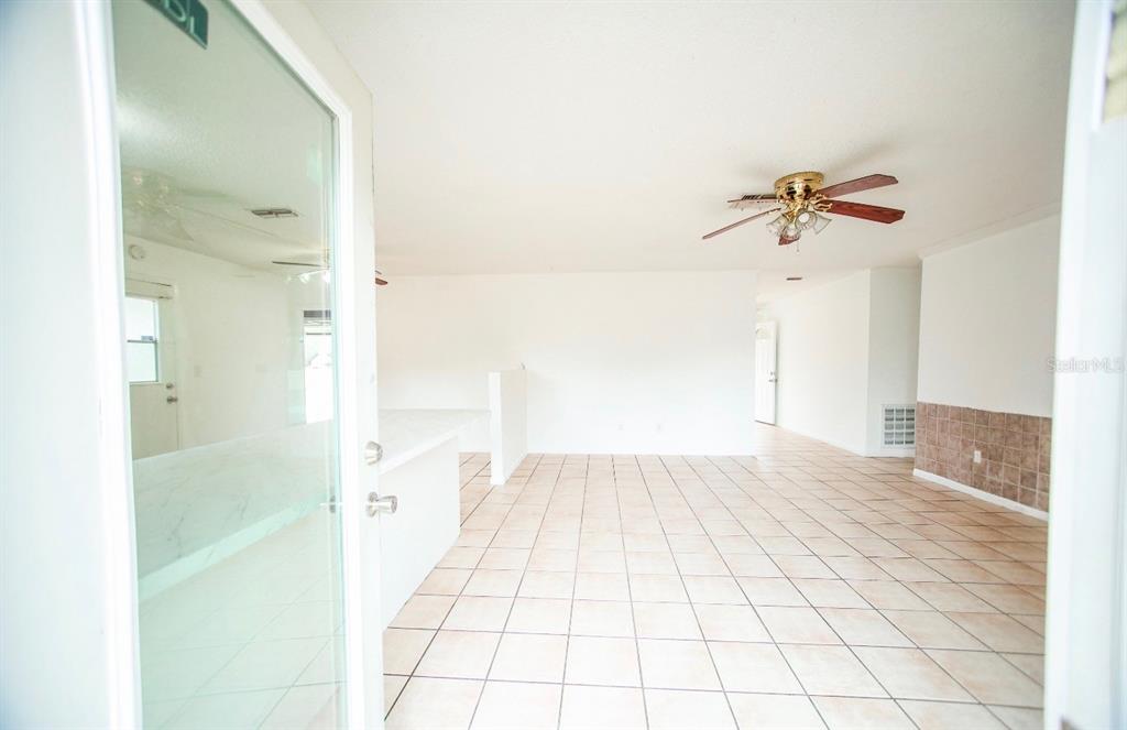 606 Water Road Ocala, FL 34472 - Photo 3 of 34 a view of a room with a hardwood floor