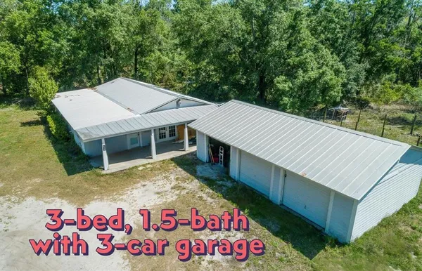 a view of a wooden house with a sign on the wall