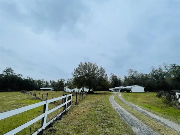 a view of a swimming pool with a yard