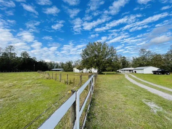 a view of a swimming pool with a yard