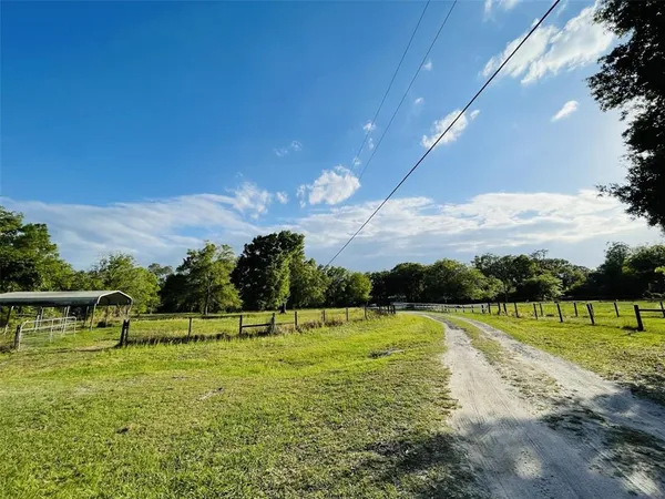 a view of a golf course with a lake