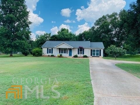 101 Cedar Ridge Road Locust Grove, GA 30248 - Photo 1 of 1 a front view of house with yard and green space
