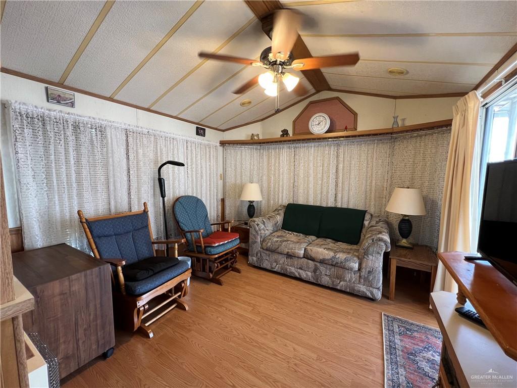 215 South Valley View Road Donna, TX 78537 - Photo 2 of 9 a living room with furniture and a flat screen tv