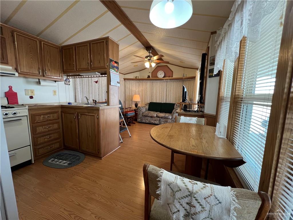 215 South Valley View Road Donna, TX 78537 - Photo 5 of 9 a kitchen with a sink appliances cabinets and furniture