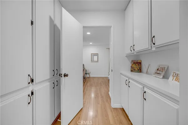 a bedroom with a bed and painting on the wall