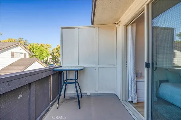 a outdoor living room with furniture and a potted plant