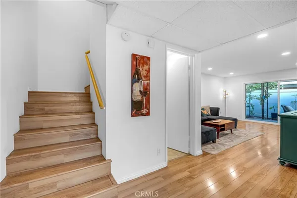 a bathroom with a granite countertop sink a toilet and a mirror