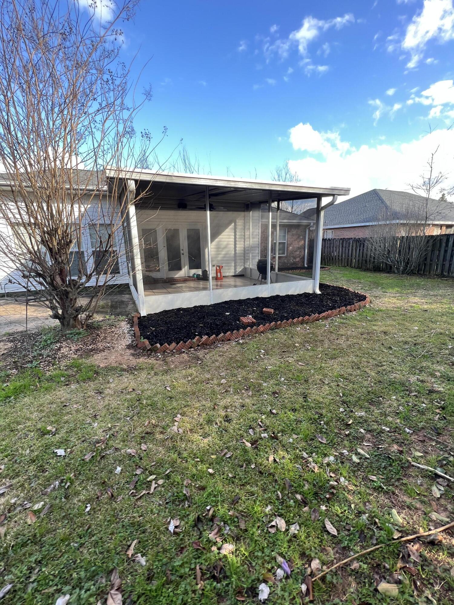 5633 North Brook Drive Crestview, FL 32539 - Photo 20 of 28 a front view of a house with garden