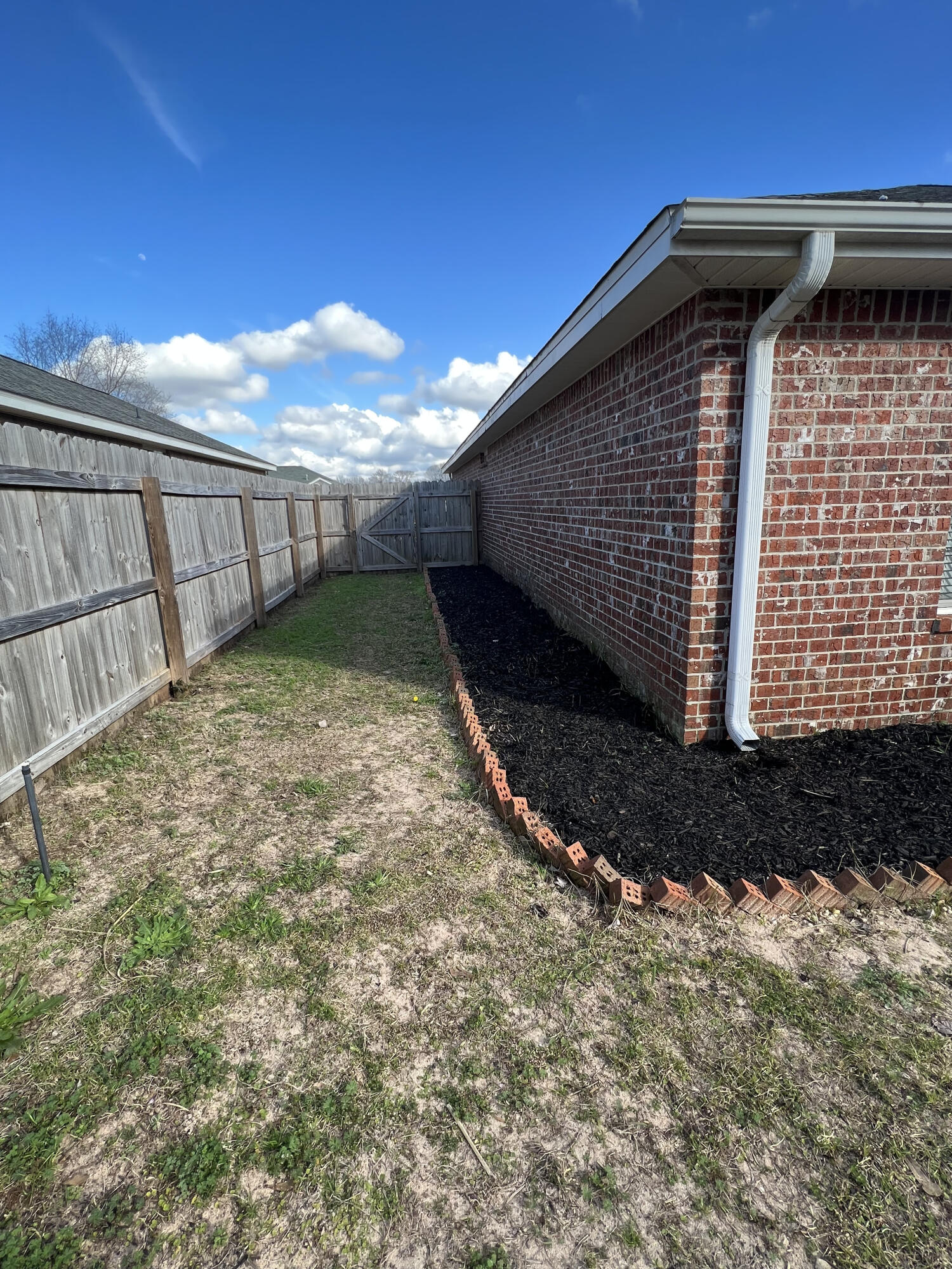 5633 North Brook Drive Crestview, FL 32539 - Photo 23 of 28 a view of a backyard of the house