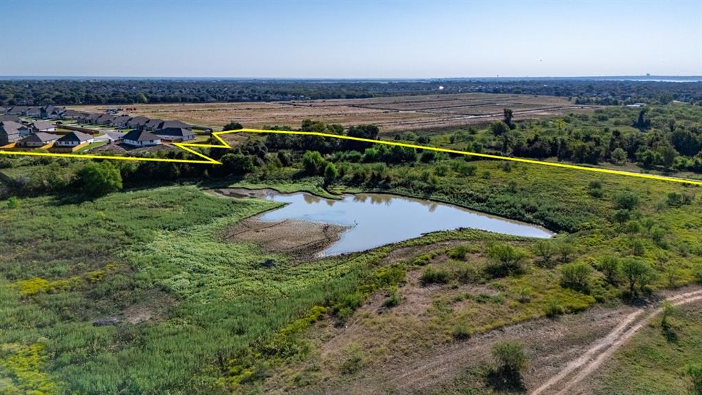 Tbd Arnett Lane Waco, TX 76708 - Photo 13 of 16 a view of a garden with a building in the background
