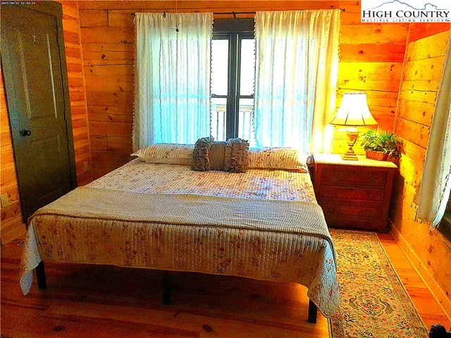 a bathroom with a shower and a mirror