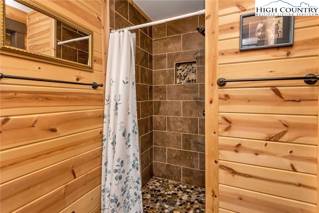1459 River Front Ridge Drive Jefferson, NC 28640 - Photo 12 of 33 a bathroom with a shower and a mirror